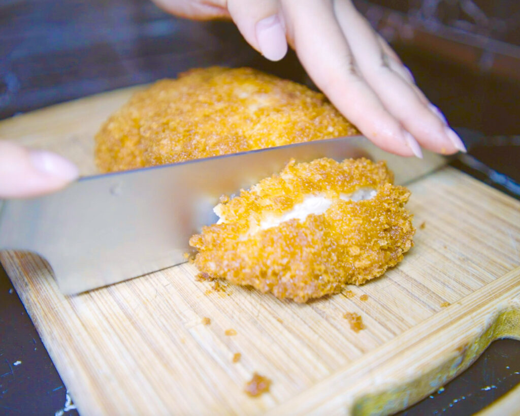 Cutting katsu chicken into slices