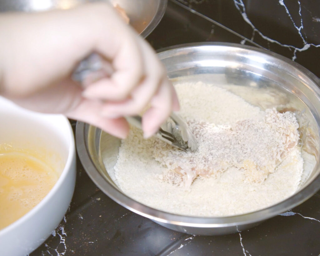 Coating chicken in panko breadcrumb